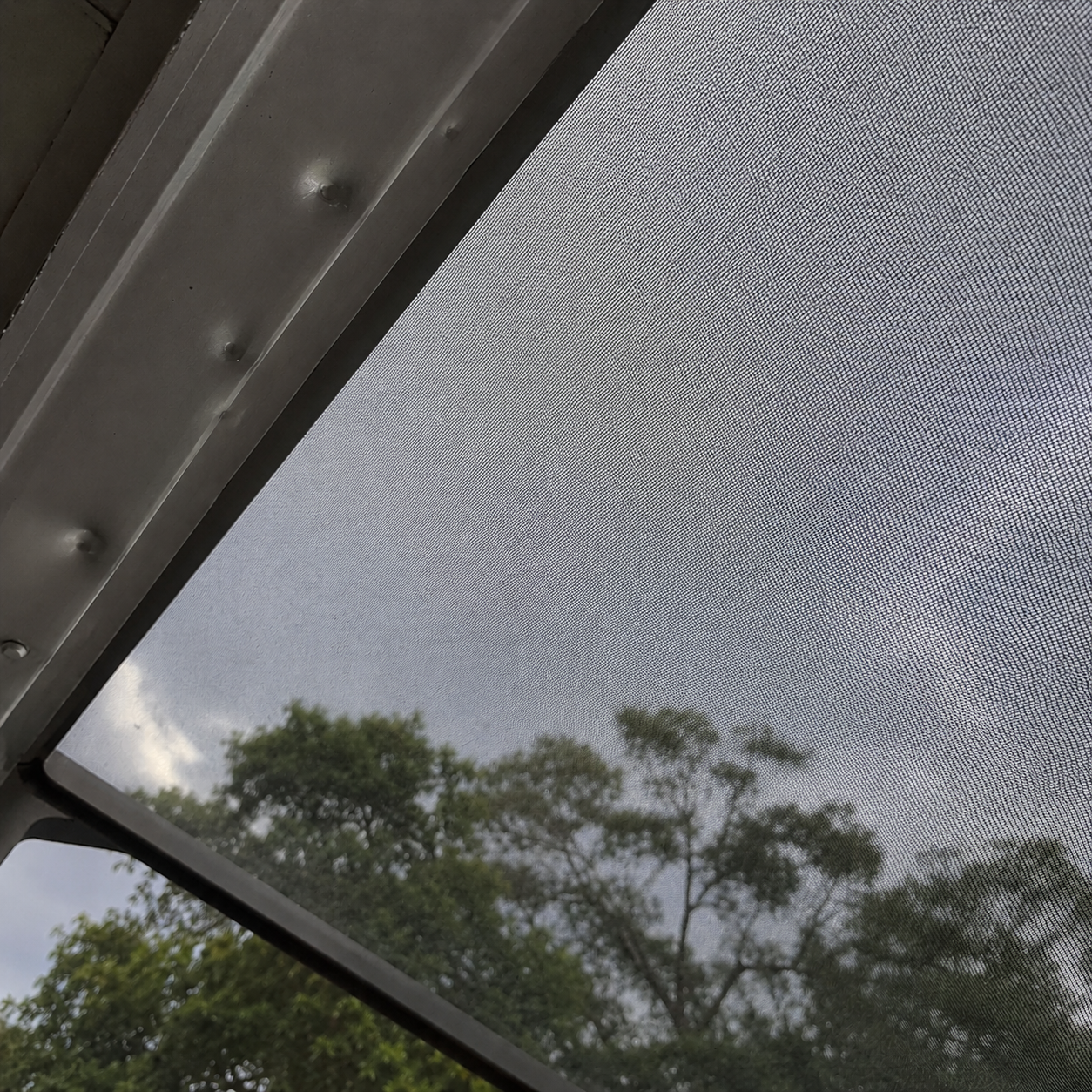 Lanai fully repaired with new mesh screen after hail damage